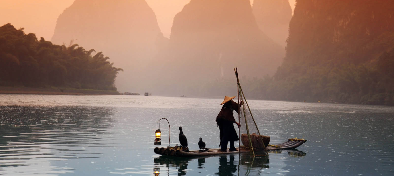 man fishing yangshuo guangxi china