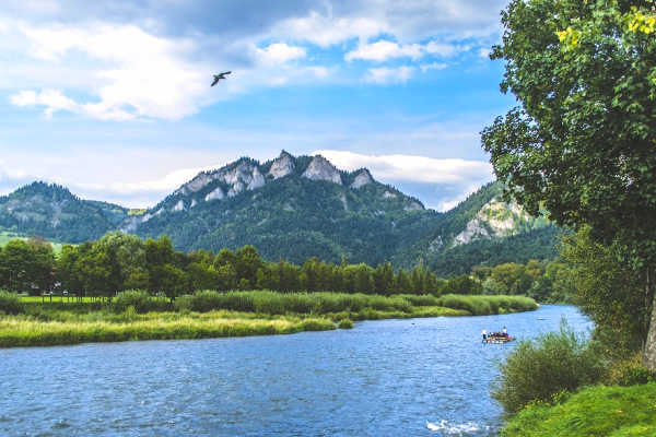 Family on small raft in Dunajec River in Poland