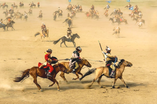 Men on Horseback During Naadam Festival in Mongolia