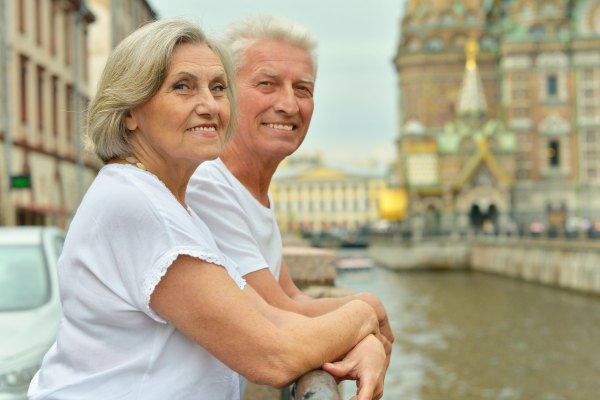 Older couple enjoying escorted guided tour in Europe