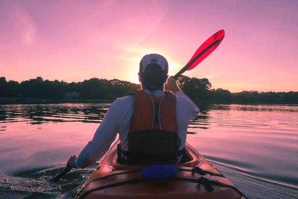 Be bold - kayaker alone at sunset