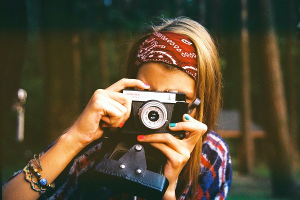 Woman with vintage camera on vacation