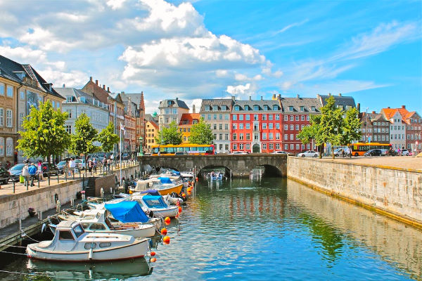 Canal and brightly colored houses in Copenhagen Denmark