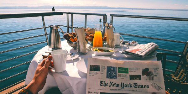 Enjoying breakfast and coffee on luxury river cruise in Europe