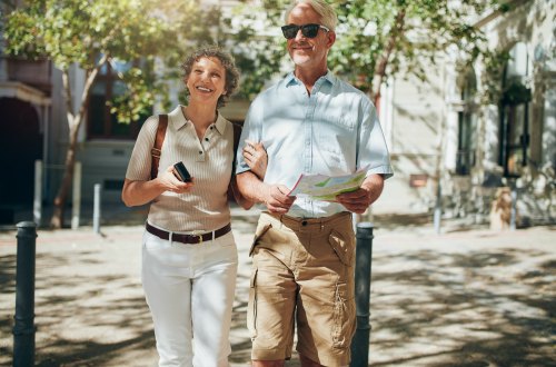 Happy seniors on guided tour in Europe