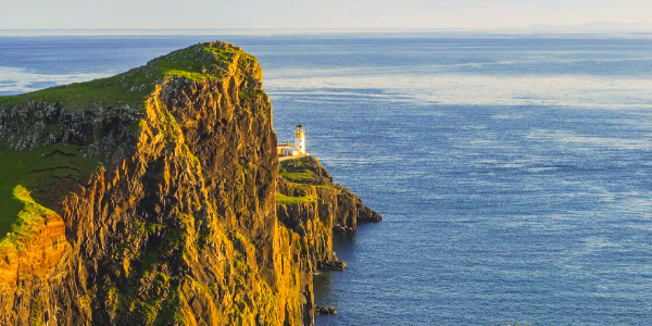 UK coastline with lighthouse, Insight Vacations