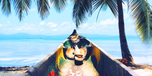 Relaxing palm trees and traditional asian boat