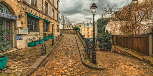 Local Paris street with guide on Monograms tour