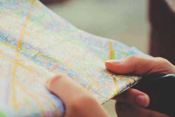 close up of map, traveler researching routes