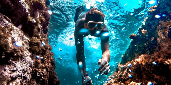 Diver with underwater camera on national geographic expeditions tour