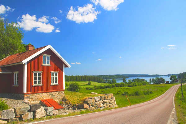 Sweden landscape with bright red barn