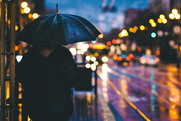 Rainy weather conditions in city at night