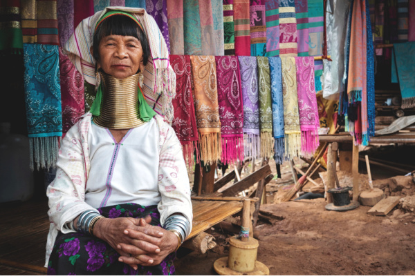 Traditional Karen long neck woman with rings around her neck in Thailand