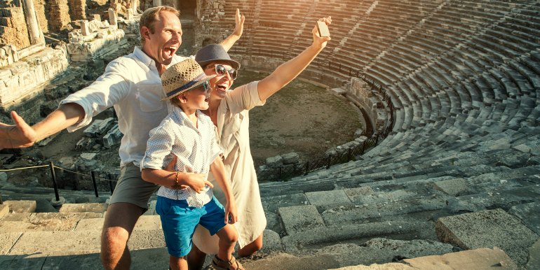 Happy family taking a selfie in Rome