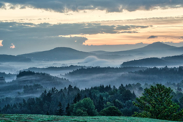 A misty dawn in Bohemian Switzerland National Park located in Czech Republic.