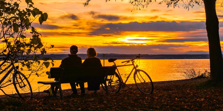 Couple biking at sunset