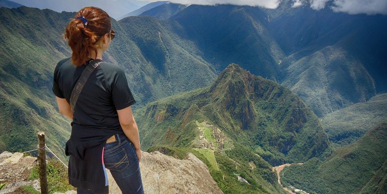 Hiker viewing Machu Picchu from above