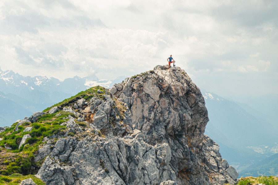 man-standing-on-cliff-in-slovenia