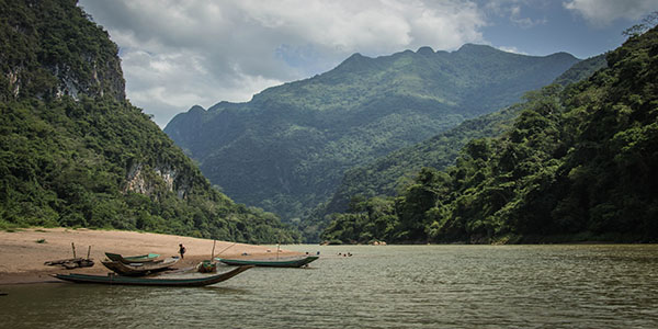 Canoeing in Laos is one of the many activities travelers can do with Swallow Travel.