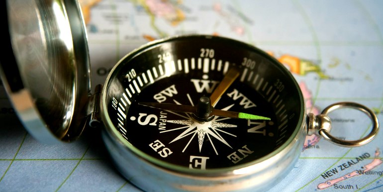 Compass on world map
