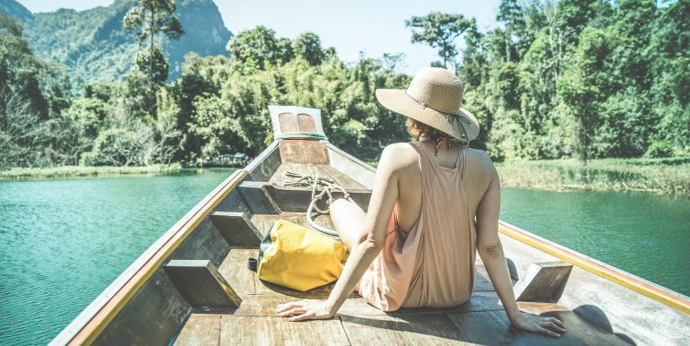 Young woman on boat in Thailand